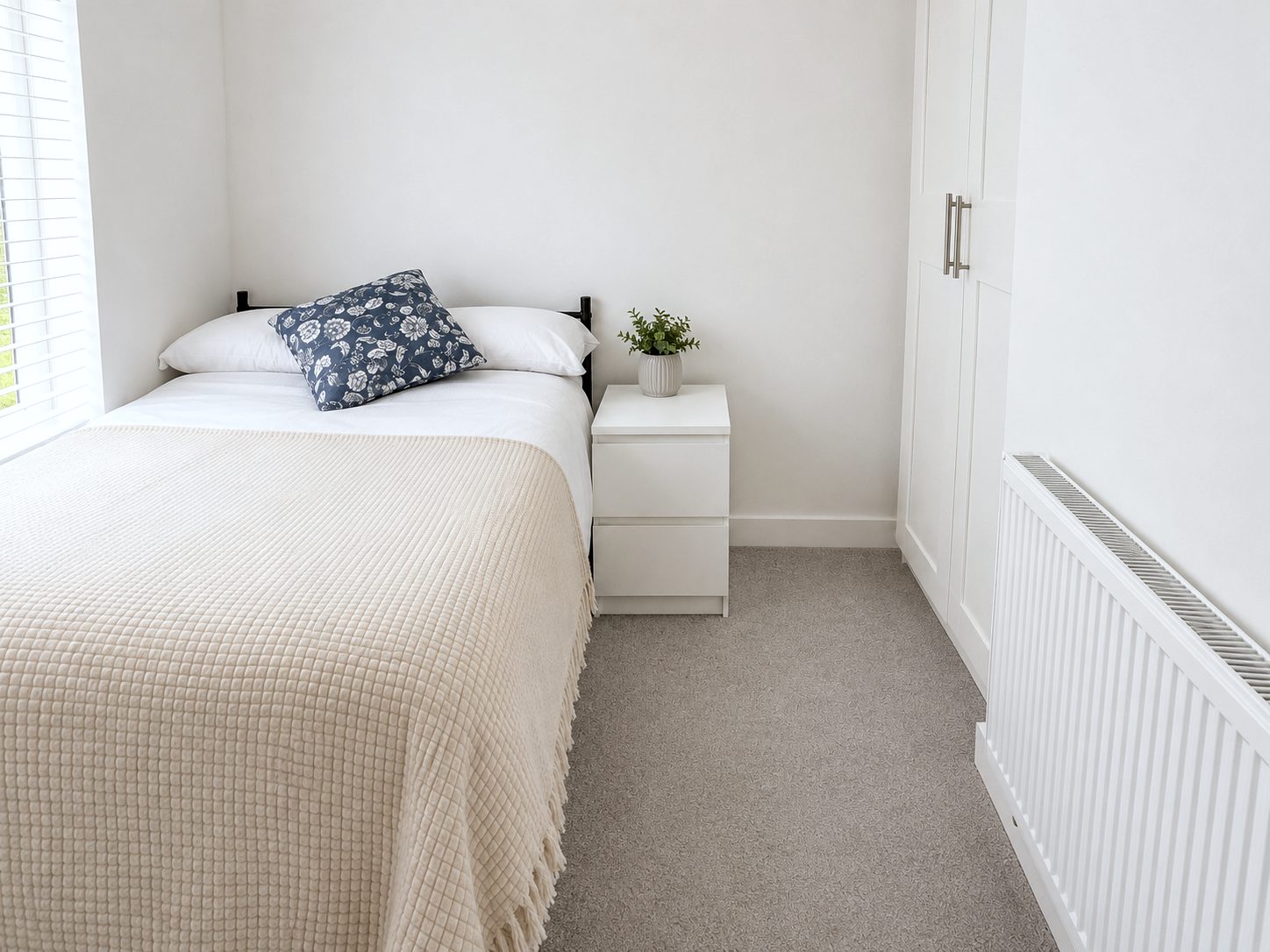 Double bed with bedside table