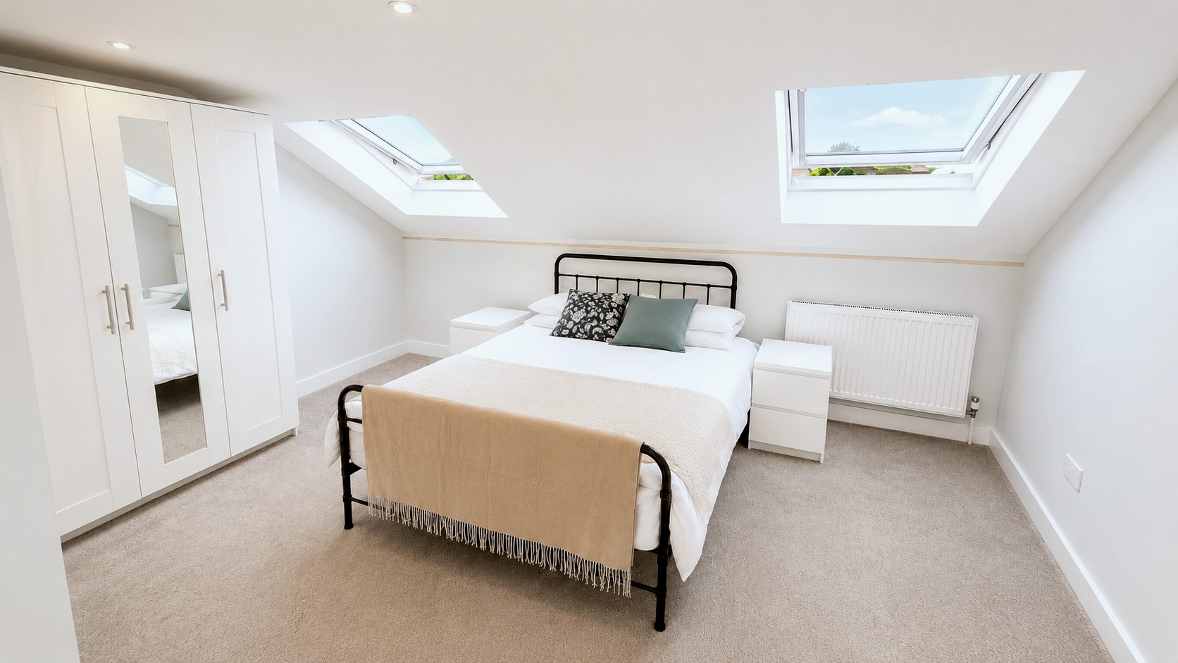 Double bed under twin skylights