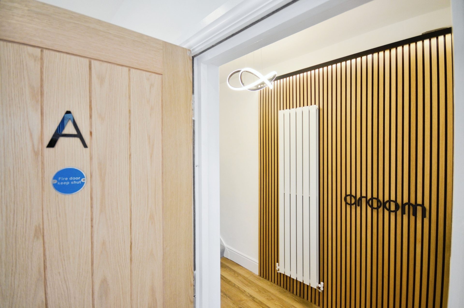 Hallway at 2 Middlecroft Lane with the Oroom sign